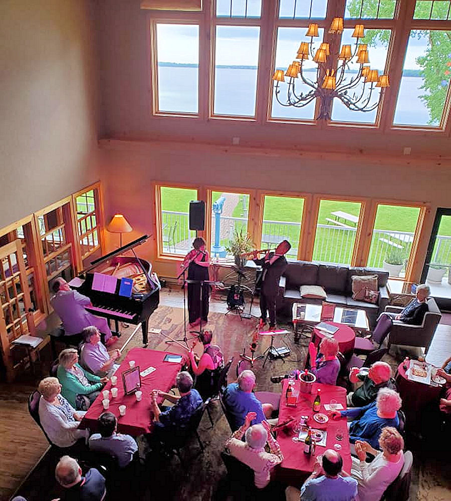 Live musical entertainment in the Fireside Lobby includes beautiful lake views at The Lodge on Lake Detroit